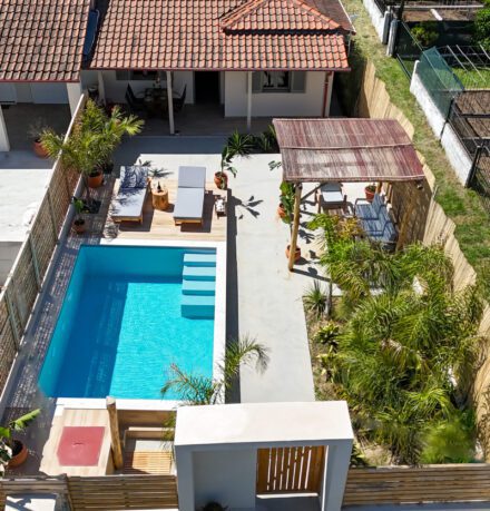 The house and the pool photo by a drone